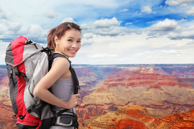 woman with clear vision happy hiking hill top at LASIK of Nevada