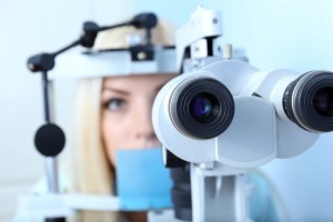 young woman having her eyes examined