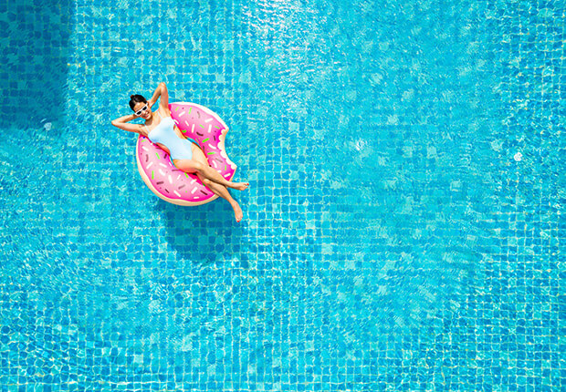 woman floating in swimming pool at LASIK of Nevada